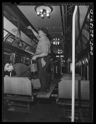 Baltimore, Maryland. Varnishing and repairing the interior of a trolley at the paint shop of the maintenance terminal of the Baltimore Transit Company