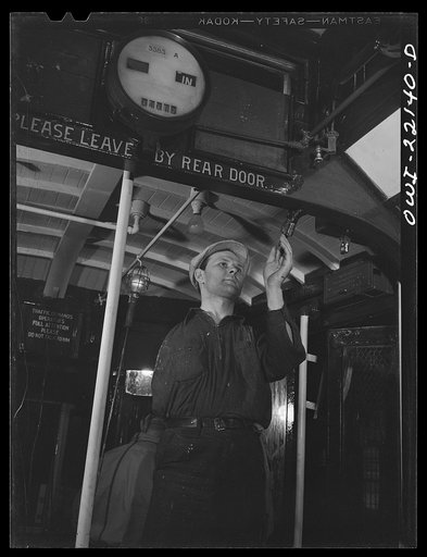 Baltimore, Maryland. One-armed painter, hired since the war, repainting the interior of a trolley at the paint shop of the maintenance terminal of the Baltimore Transit Company