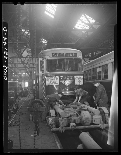 Baltimore, Maryland. Repairing the motor of a PCC trolley. Most recent trolley model designed in 1936 by a group of manufacturers and transit companies in an effort to standardize, simplify, and bring down the price; at the damage shop, maintenance terminal of the Baltimore Transit Company