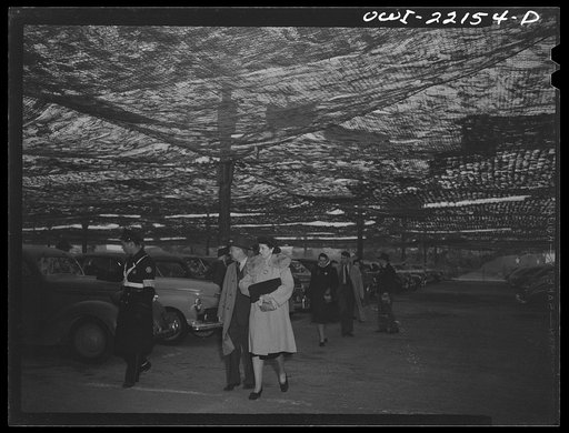 Baltimore, Maryland. Workers arriving in shared cars at the Glenn L. Martin camouflaged parking space at seven a.m.