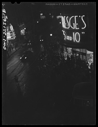 Untitled photo, possibly related to: Baltimore, Maryland. Shopping district just before closing time at nine p.m. on Thursday night