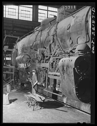 San Bernardino, California. Ramona Estrada, a sweeper in the Atchison, Topeka and Santa Fe Railroad locomotive shops. Her father is an orange picker and her sister works at an orange packing plant