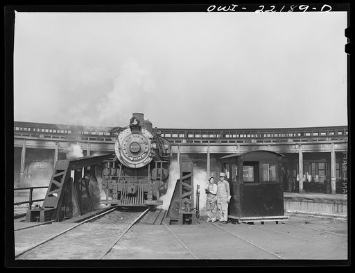 San Bernardino, California.  An engine on the transfer table at the Atchison, Topeka and Santa Fe Railroad roundhouse
