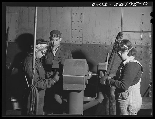San Bernardino, California. Cleaning secondhand bolts for reissue at the Atchison, Topeka and Santa Fe Railroad shops. Left to right: E.R. Gabrera, Rudolph Espino, and Natalia R. Moyeda