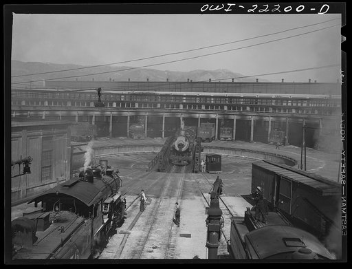 San Bernardino, California. Engines being serviced at the Atchison, Topeka and Santa Fe Railroad roundhouse