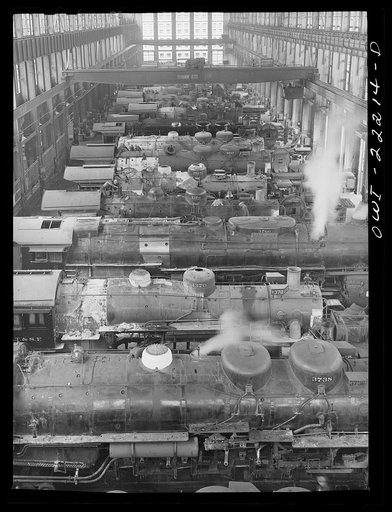 Untitled photo, possibly related to: San Bernardino, California. Locomotive under repair in the Atchison, Topeka, and Santa Fe Railroad locomotive shops