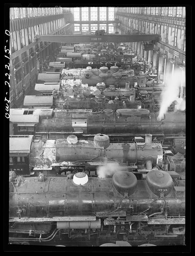 San Bernardino, California. Locomotive under repair in the Atchison, Topeka, and Santa Fe Railroad locomotive shops