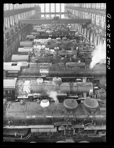 Untitled photo, possibly related to: San Bernardino, California. Locomotive under repair in the Atchison, Topeka, and Santa Fe Railroad locomotive shops
