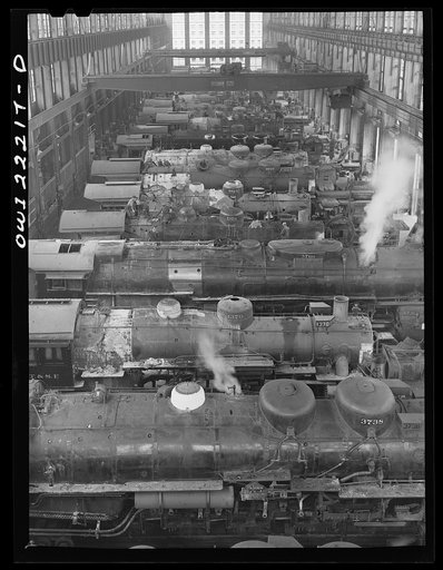 Untitled photo, possibly related to: San Bernardino, California. Locomotive under repair in the Atchison, Topeka, and Santa Fe Railroad locomotive shops