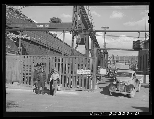 Untitled photo, possibly related to: Albuquerque, New Mexico. Men coming out of the Atchison, Topeka, and Santa Fe Railroad shops at the end of the day's shift