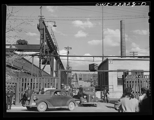 Albuquerque, New Mexico. Men coming out of the Atchison, Topeka, and Santa Fe Railroad shops at the end of the day's shift