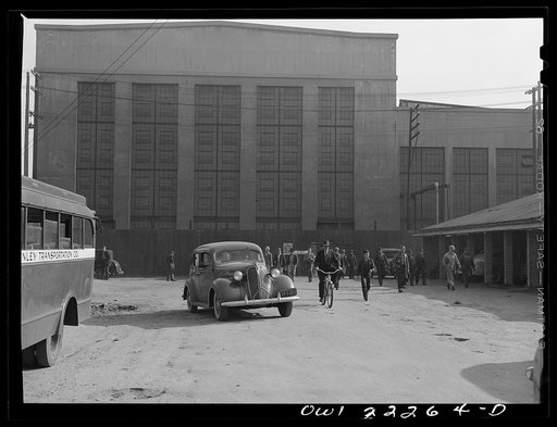 San Bernardino, California. Men coming out of work at the end of a day's shift at the Atchison, Topeka, and Sante Fe Railroad shops