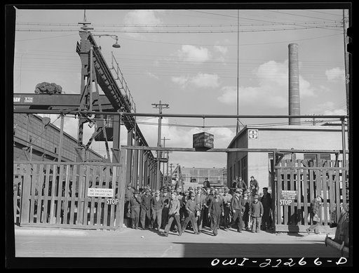 Albuquerque, New Mexico. Men coming out of the Atchison, Topeka, and Santa Fe Railroad shops at the end of the day's shift
