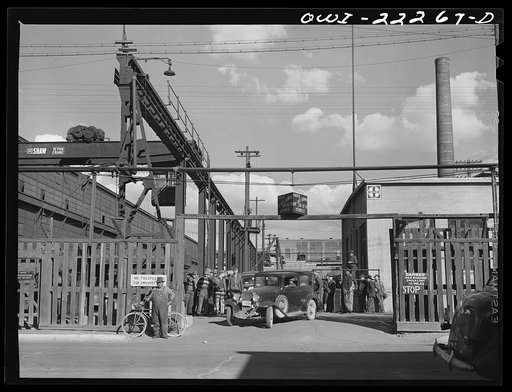 Untitled photo, possibly related to: Albuquerque, New Mexico. Men coming out of the Atchison, Topeka, and Santa Fe Railroad shops at the end of the day's shift