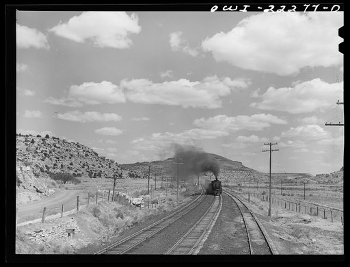 Acomita, New Mexico. A westbound Atchison, Topeka, and Santa Fe Railroad train enroute to Gallup