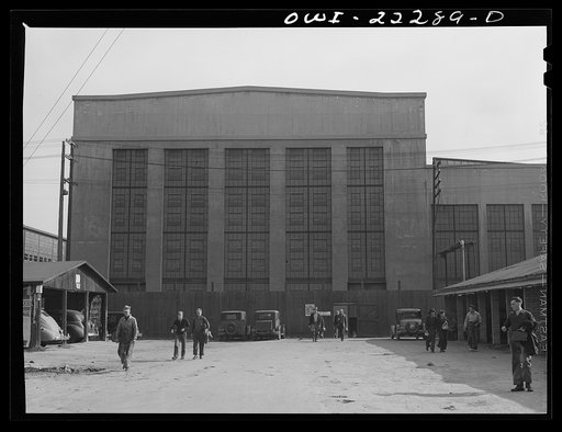 Untitled photo, possibly related to: San Bernardino, California. Men coming out of work at the end of a day's shift at the Atchison, Topeka and Santa Fe Railroad