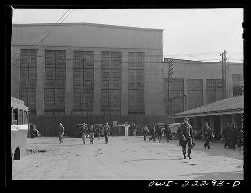 San Bernardino, California. Men coming out of work at the end of a day's shift at the Atchison, Topeka and Santa Fe Railroad