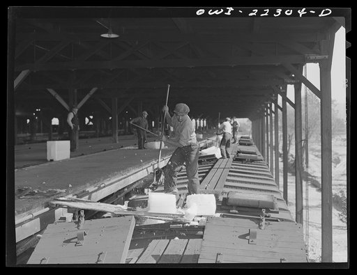 San Bernardino, California. Icing Atchison, Topeka and Santa Fe Railroad refrigerator cars at the ice plant