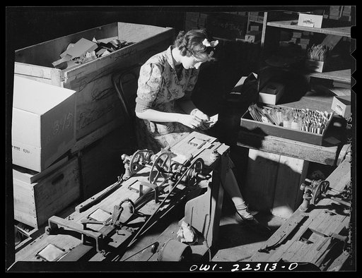 Philadelphia, Pennsylvania. Sealing envelopes containing seed at the W. Atlee Burpee Company, seed dealers