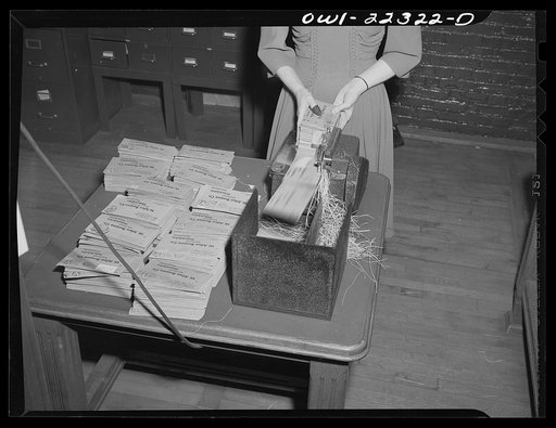 Philadelphia, Pennsylvania. Machine for slitting envelopes at the W. Atlee Burpee Company, seed dealers