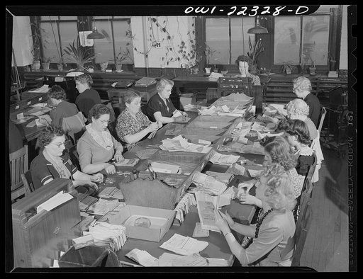 Philadelphia, Pennsylvania. Opening order envelopes and checking money received at the W. Atlee Burpee Company, seed dealers