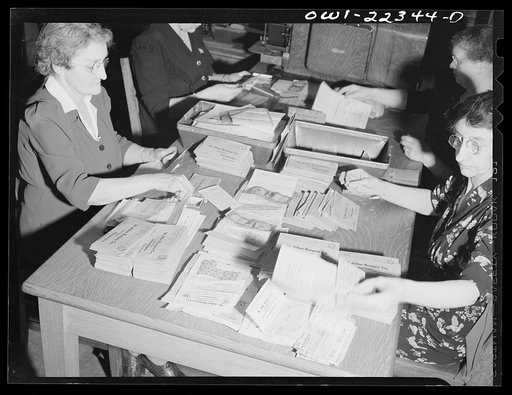 Philadelphia, Pennsylvania. Removing money from order envelopes at the W. Atlee Burpee Company, seed dealers