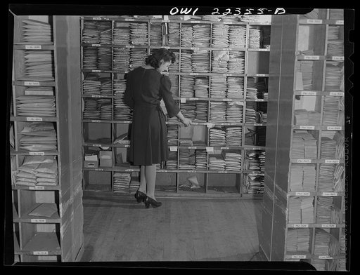 Philadelphia, Pennsylvania. Collecting packages from seed racks to make up an order at the W. Atlee Burpee Company, seed dealers