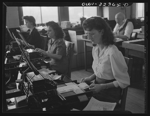 Untitled photo, possibly related to: Philadelphia, Pennsylvania. Typing address labels at the W. Atlee Burpee Company, seed dealers. Typing on a flat bed typewriter