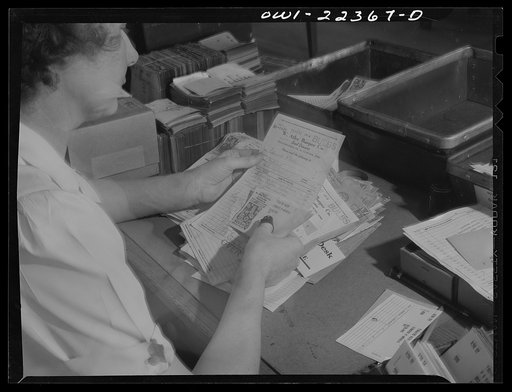 Philadelphia, Pennsylvania. Punching code information on mailing stencils at the W. Atlee Burpee Company, seed dealers