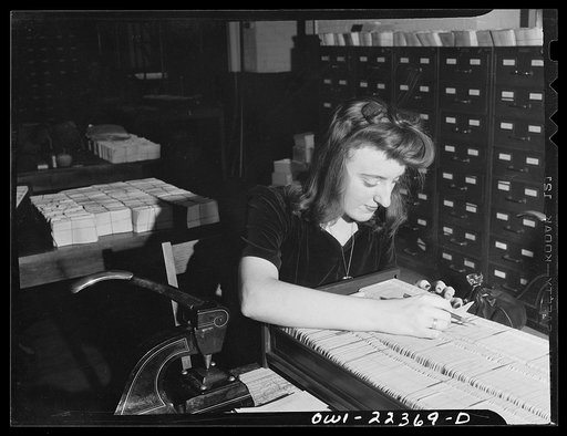 Untitled photo, possibly related to: Philadelphia, Pennsylvania. Punching code information on mailing stencils