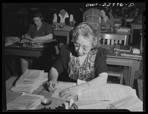 Philadelphia, Pennsylvania. Checking seed order against catalog at the W. Atlee Burpee Company, seed dealers