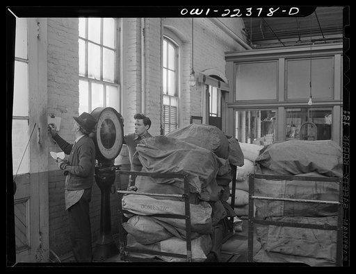 Philadelphia, Pennsylvania. Weighing outgoing mail at the W. Atlee Burpee Company, seed dealers