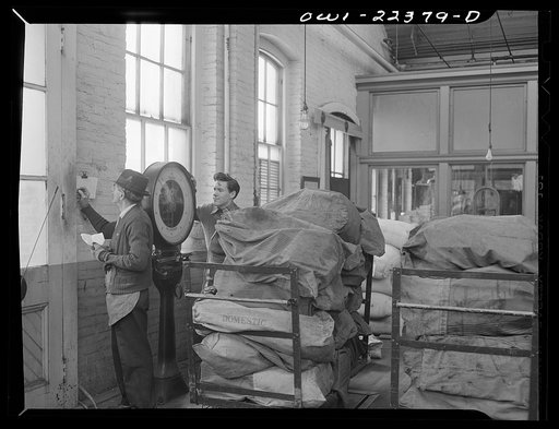 Untitled photo, possibly related to: Philadelphia, Pennsylvania. Weighing outgoing mail at the W. Atlee Burpee Company, seed dealers