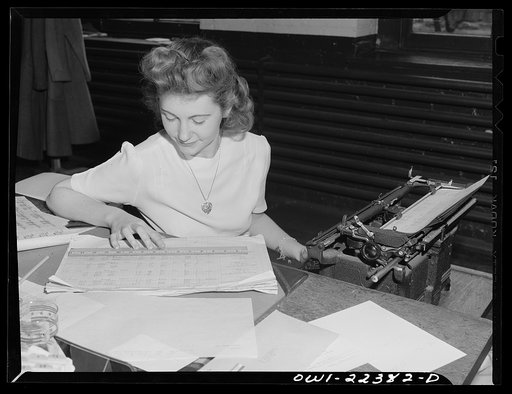 Philadelphia, Pennsylvania. Assembling the totals for the day at the W. Atlee Burpee Company, seed dealer