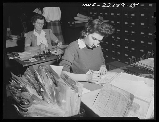 Philadelphia, Pennsylvania. Checking amounts of the order at the W. Atlee Burpee Company, seed dealers