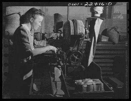 Philadelphia, Pennsylvania. Seed filling machine at the W. Atlee Burpee Company, seed dealers