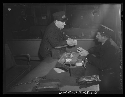 Baltimore, Maryland. Trolley conductors counting their receipts at the Park Terminal, the dispatch center of the Baltimore Transit Company