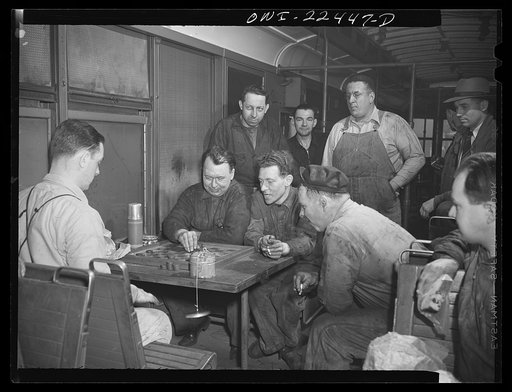 Baltimore, Maryland. Employees at the maintenance terminal of the Baltimore Transit Company having lunch and playing checkers in an old trolley made into a smoker