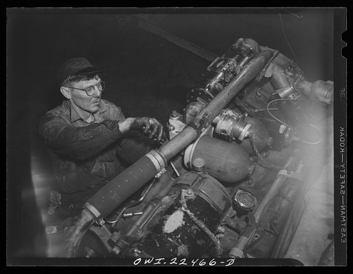 Baltimore, Maryland. Repairing a bus motor at the Washington terminal, maintenance plant of the Baltimore Transit Company