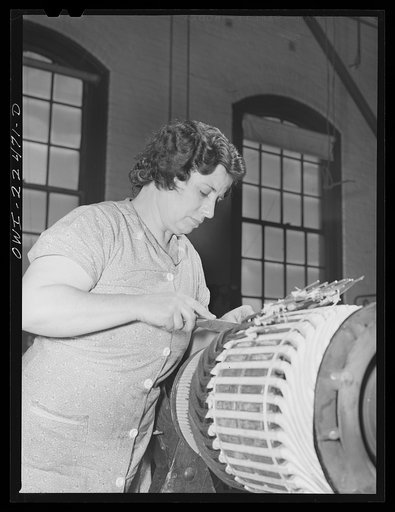 Baltimore, Maryland. Woman winding the armature of a trolley motor in the armature shop of Washington terminal, maintenance plant of the Baltimore Transit Company. This woman was first employed by the company during the last war. No new women have been hired in the maintenance plant in this emergenc