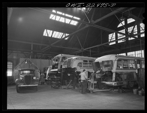 Baltimore, Maryland. Repairing busses at the Washington terminal, maintenance depot of the Baltimore Transit Company. Automobile at the extreme left transports parts