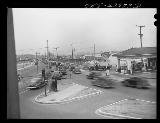 Untitled photo, possibly related to: Baltimore, Maryland. Traffic jam as workers of the first shift leave the Belthlehem Fairfield shipyards in cars and trolleys on the road to Baltimore