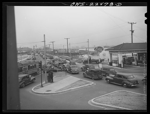 Baltimore, Maryland. Traffic jam as workers of the first shift leave the Belthlehem Fairfield shipyards in cars and trolleys on the road to Baltimore