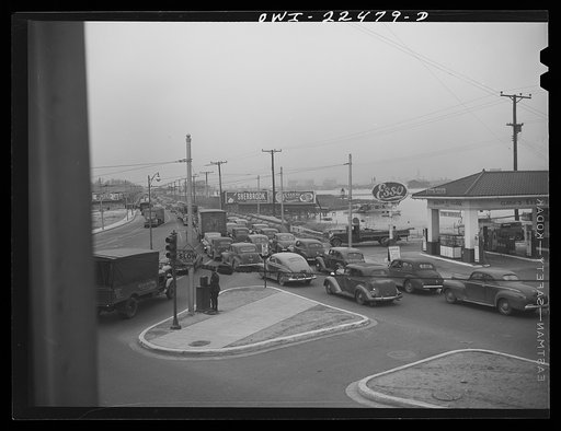 Untitled photo, possibly related to: Baltimore, Maryland. Traffic jam as workers of the first shift leave the Belthlehem Fairfield shipyards in cars and trolleys on the road to Baltimore