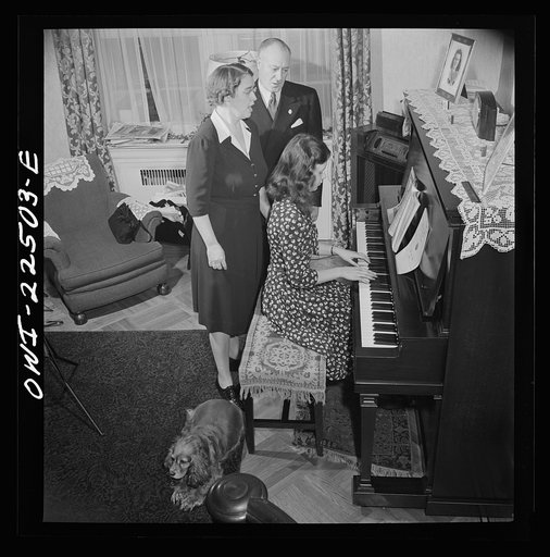 Untitled photo, possibly related to: Philadelphia, Pennsylvania. Swedish-American executive at the SKF roller bearing factory sings Swedish songs with his wife and daughter