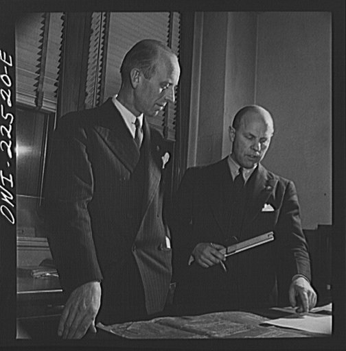 Philadelphia, Pennsylvania. Swedish-American vice president of the SKF roller bearing factory and engineer looking over a blueprint