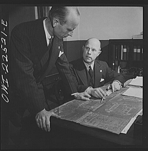Philadelphia, Pennsylvania. Swedish-American vice-president and engineer of the SKF roller bearing factory looking over a blueprint