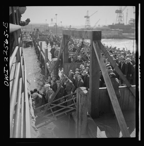 Untitled photo, possibly related to: Baltimore, Maryland. Bethlehem Fairfield shipyard workers boarding a former Wilson Line pleasure boat, now used for workers' transportation, to get back to Baltimore from the second shift