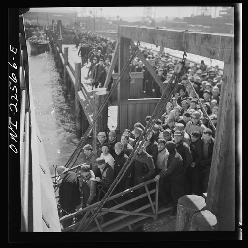 Untitled photo, possibly related to: Baltimore, Maryland. Bethlehem Fairfield shipyard workers boarding a former Wilson Line pleasure boat, now used for workers' transportation, to get back to Baltimore from the second shift