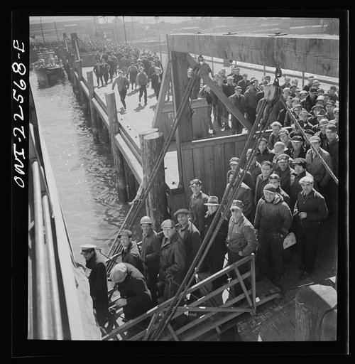 Baltimore, Maryland. Bethlehem Fairfield shipyard workers boarding a former Wilson Line pleasure boat, now used for workers' transportation, to get back to Baltimore from the second shift